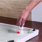 TM-I (2) Screw Leg Into Tray Screw the leg securely to the BathEmpire EasyPlumb Tray